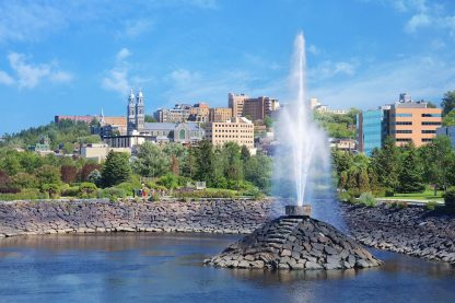Chicoutimi City and Fountain over the Saguenay River - Royalty-Free Stock Images