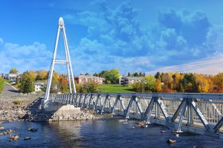 Modern Pedestrian River Cross Footbridge in Saguenay - Royalty-Free Stock Images
